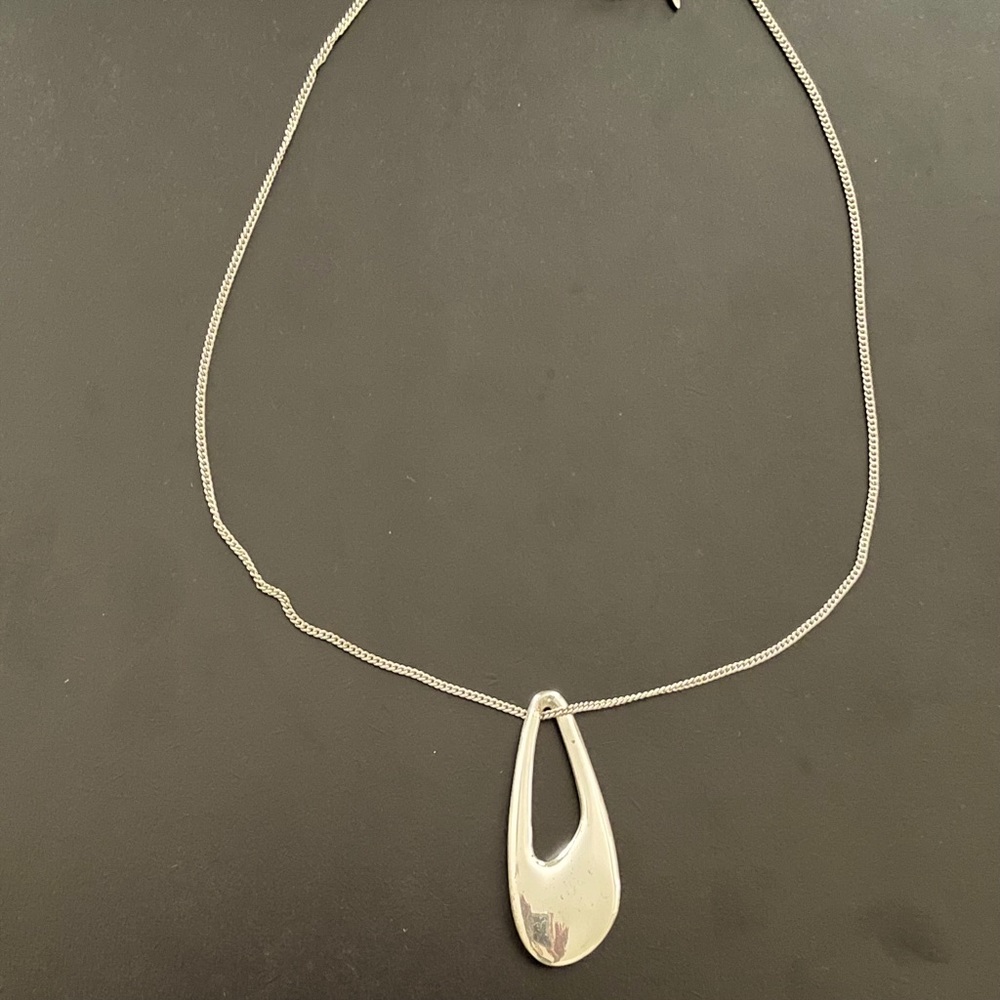 Silvertone NRT necklace